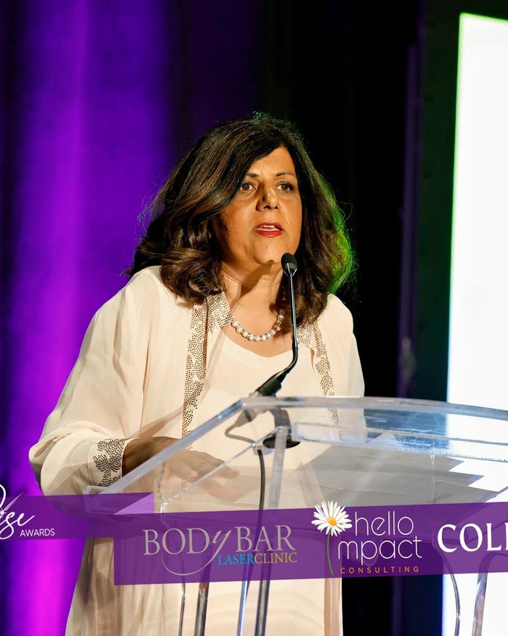Mohini Singh speaking at a Kelowna community event